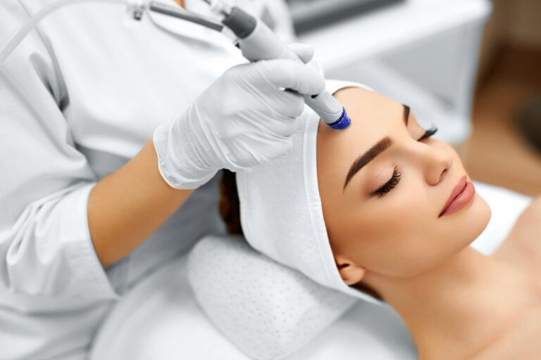 Face Skin Care. Woman Getting Facial Hydro Microdermabrasion Peeling Treatment Exfoliation, Rejuvenation And Hydratation.